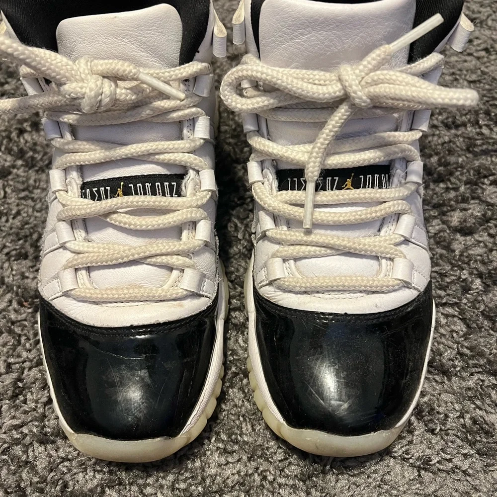 Nike Air Jordan 11 Kids Black and White Sneakers with gold jumpman - Picture 1 of 7